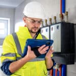 technician inspecting tablet