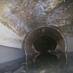 CCTV drain inspection showing a pipe belly holding water and restricting flow in Napier