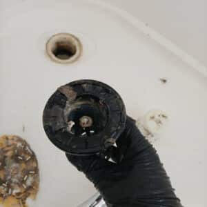 Blocked shower drain hair trap with heavy buildup causing slow drainage in Napier Hawke’s Bay