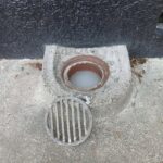 Raised gully trap holding wastewater in Pirimai, Hawke’s Bay, showing a common sign of a blocked or restricted wastewater drain